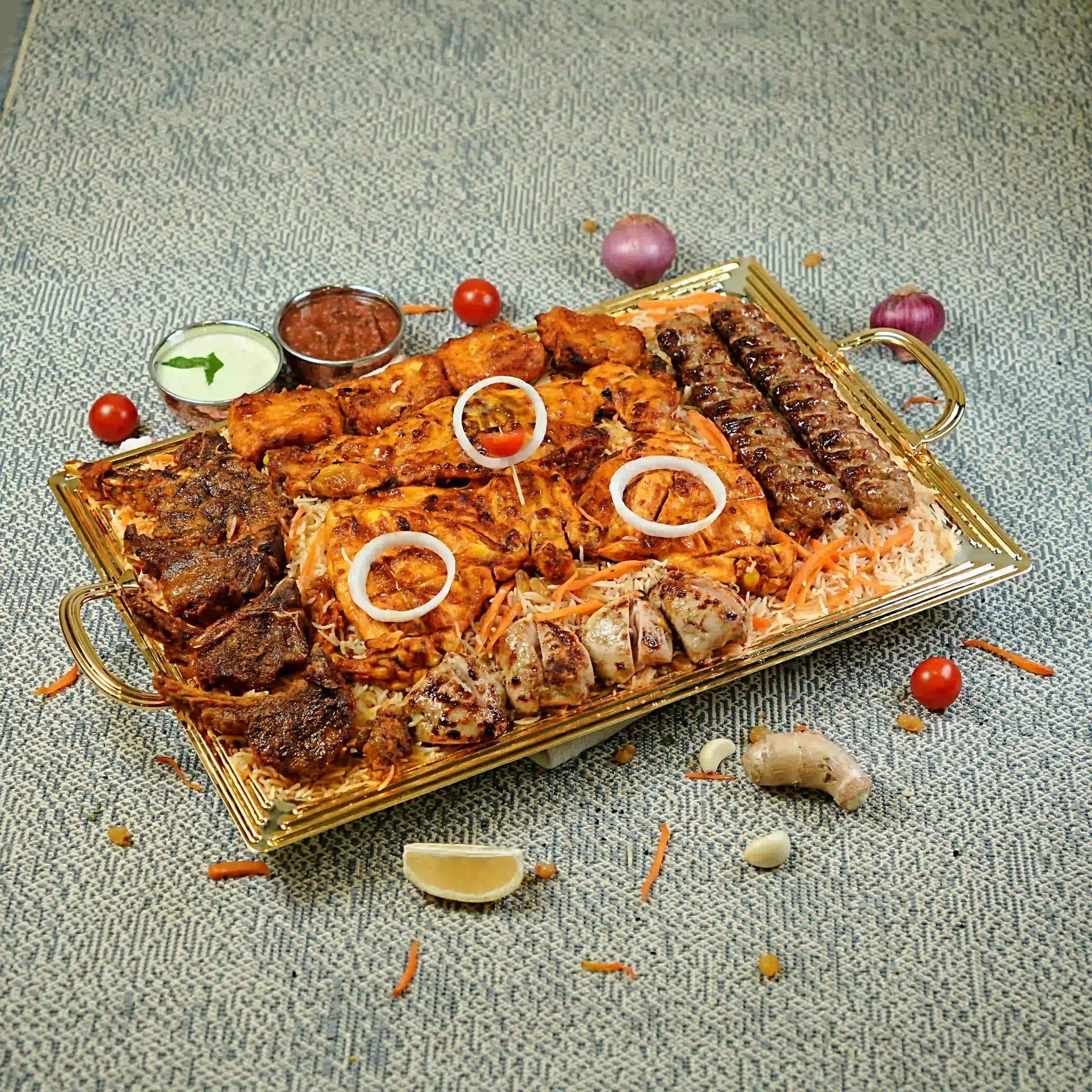 Special pulao platter with grilled meat, salad and raita at Zafran Kitchen Ajman