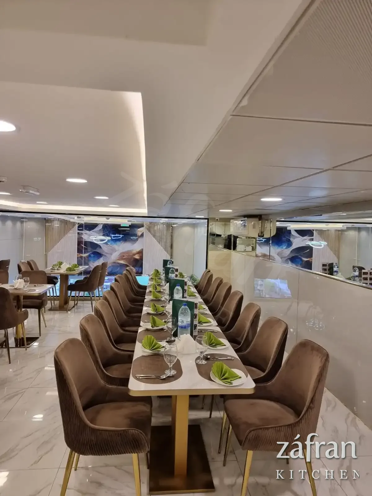 Indoor family seating at Zafran Kitchen and Restaurant, Ajman Industrial Area 2, with tables laid for a group